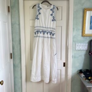 White maxi dress with blue embroidery.